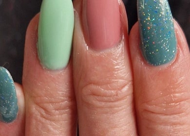 Colorful, glitter-accented nails showcased by Xtreme Beauty (Mobile Therapist) in Ponteland, England, GB.