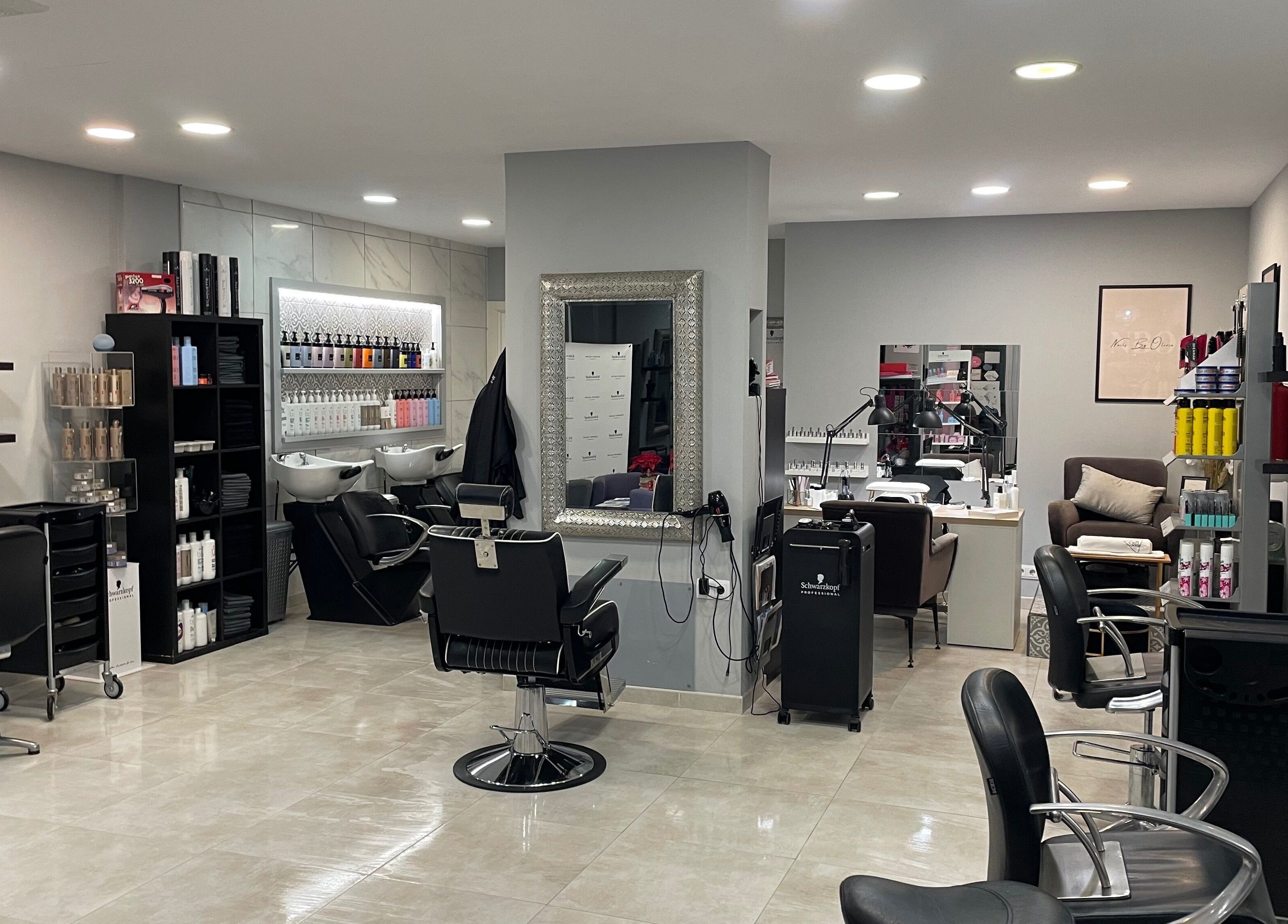 Interior of Gemini Salon in Calvià, Illes Balears, ES, featuring stylish chairs and hair products.