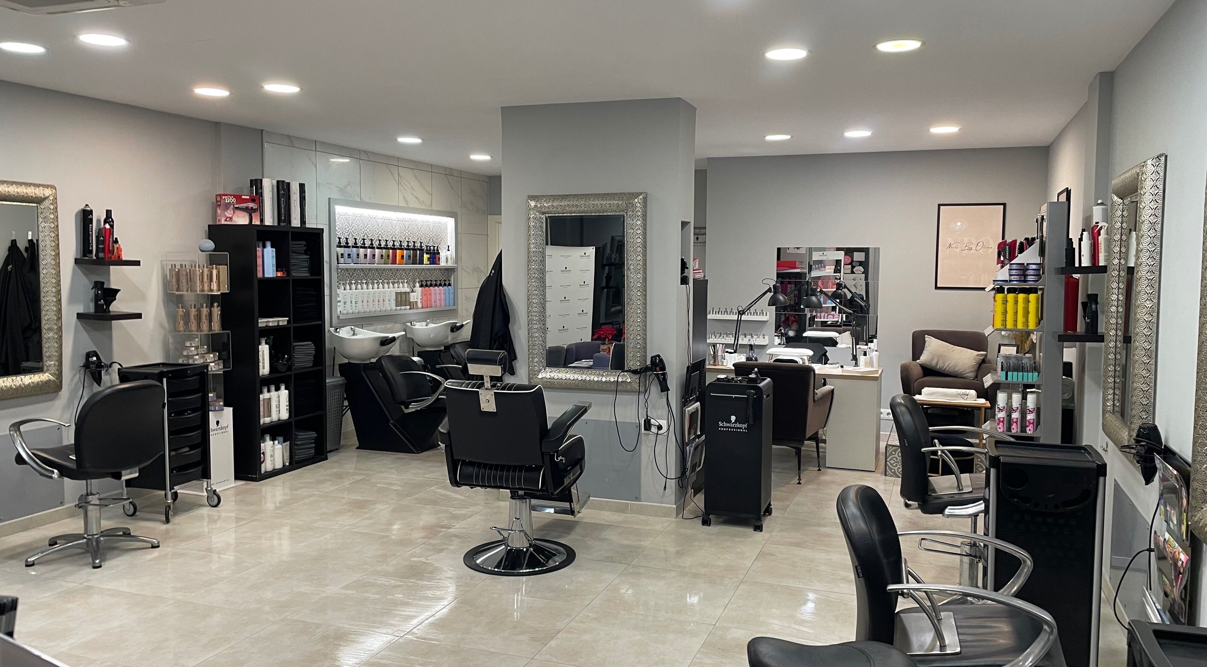 Interior of Gemini Salon in Calvià, Illes Balears, ES, featuring stylish chairs and hair products.