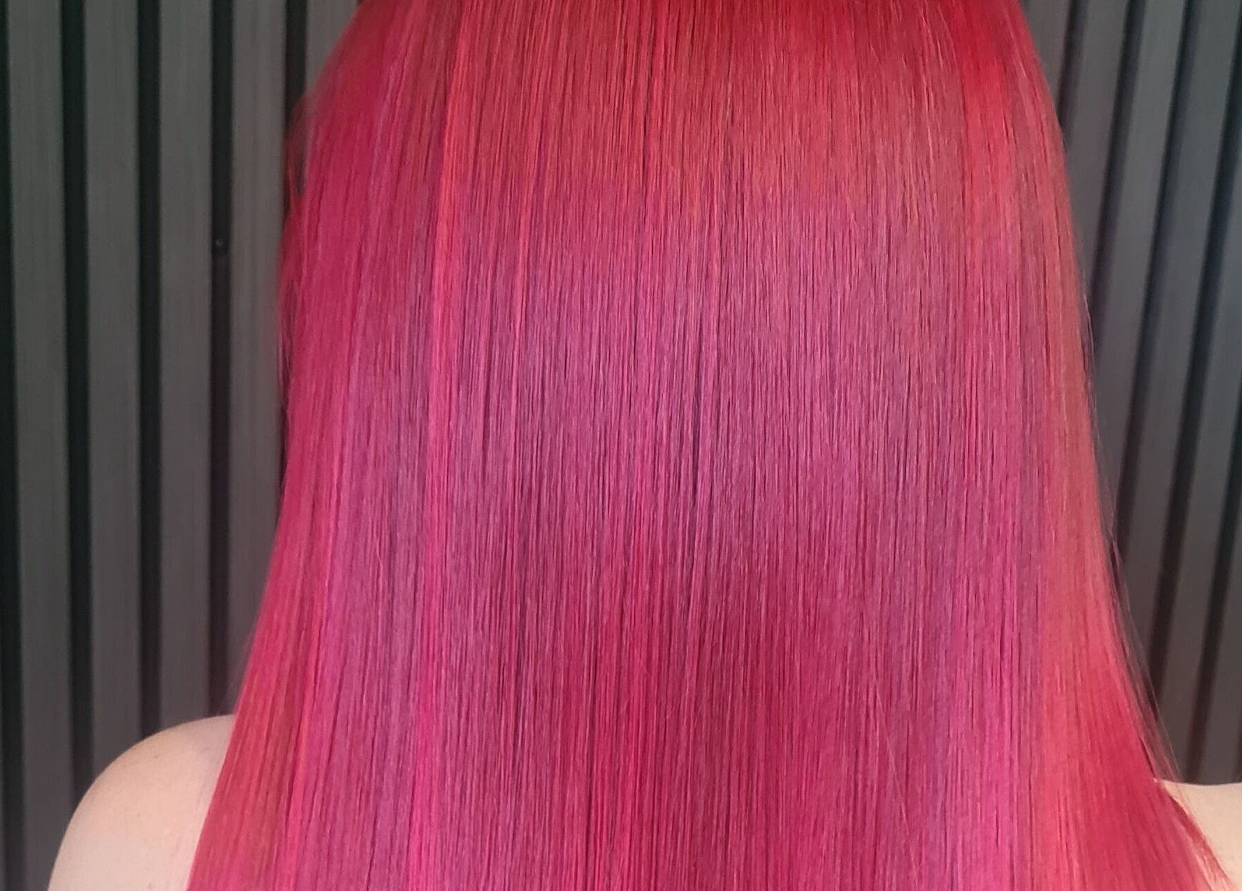 Vibrant red hair color styled perfectly at Luxe & Co ByAshHair, Cardiff, Wales, GB.