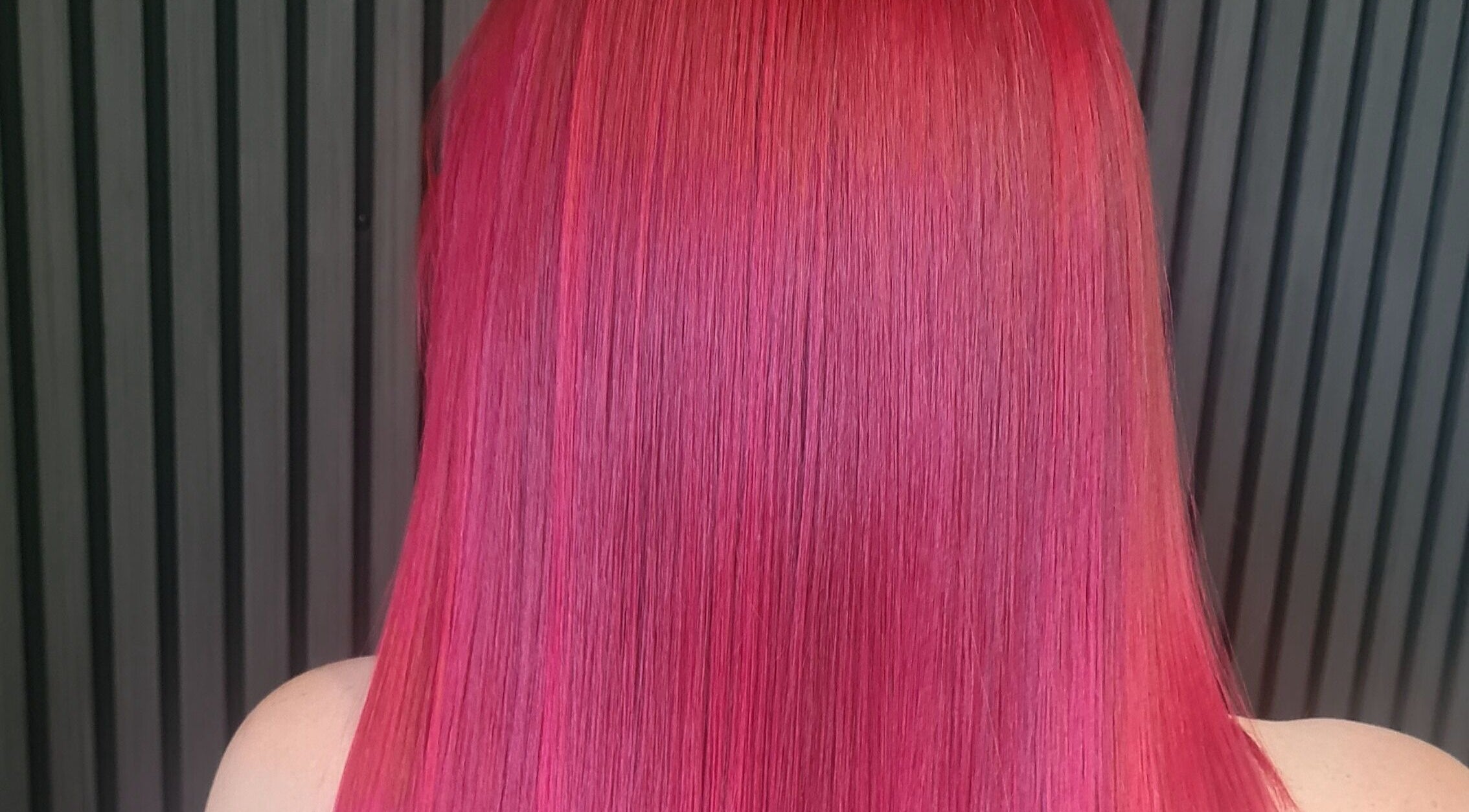 Vibrant red hair color styled perfectly at Luxe & Co ByAshHair, Cardiff, Wales, GB.