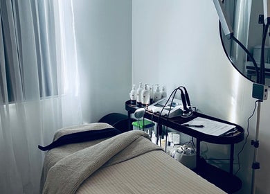 Serene treatment room at The Beauty Loft, Waihi Beach, Bay Of Plenty, NZ with a spa bed and tools.