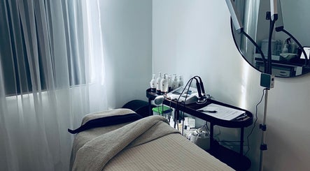 Serene treatment room at The Beauty Loft, Waihi Beach, Bay Of Plenty, NZ with a spa bed and tools.