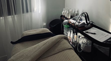 Relaxing treatment room at The Beauty Loft, Waihi Beach, Bay Of Plenty, NZ, featuring modern equipment and cozy ambiance.