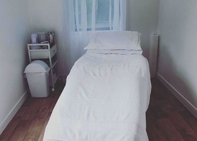 Serene treatment room at The Beauty Loft, Waihi Beach, Bay Of Plenty, NZ, featuring a comfortable treatment bed.