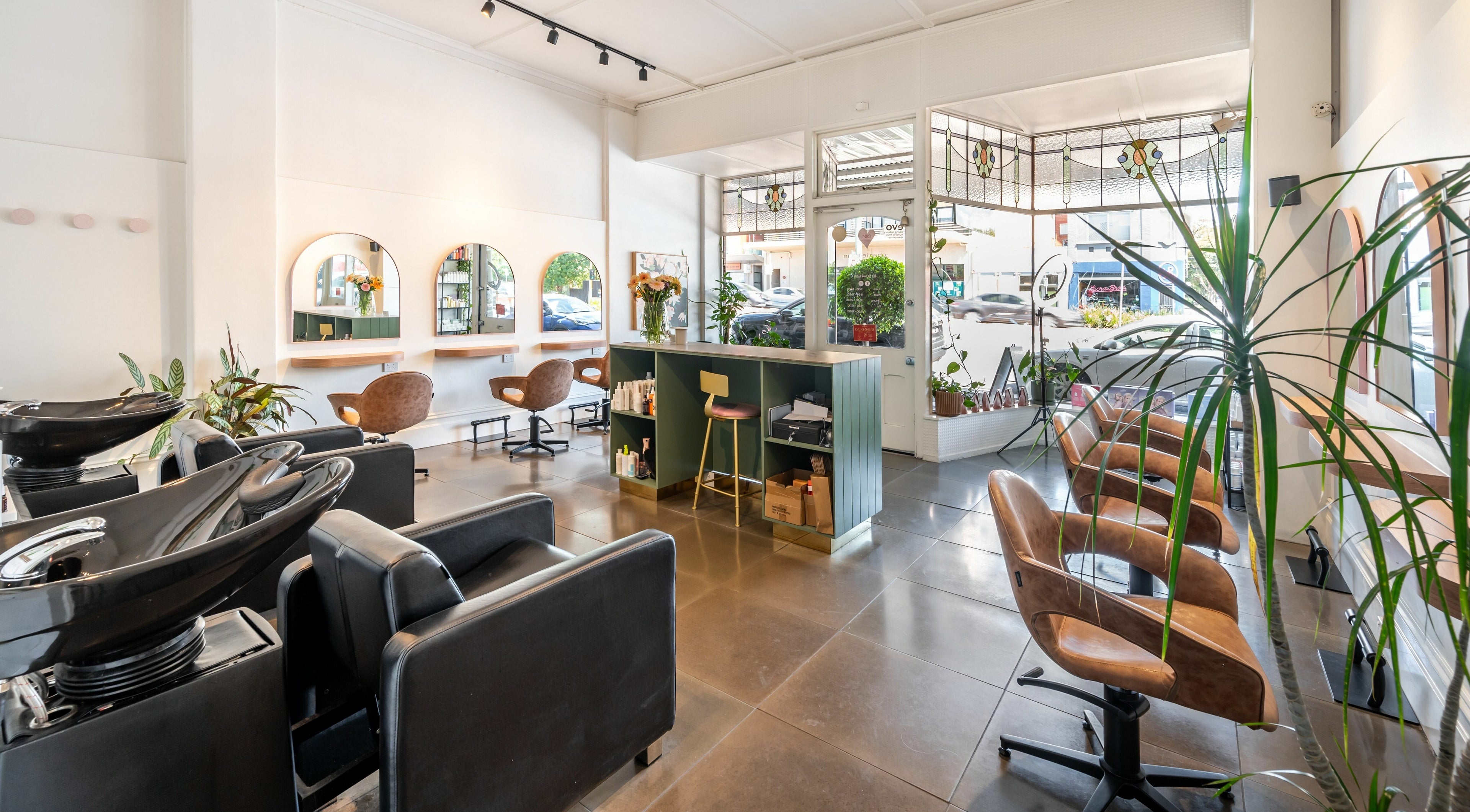 Elegant interior of Charlie Bean Salon in Melbourne, Victoria, AU showcasing modern design and seating.