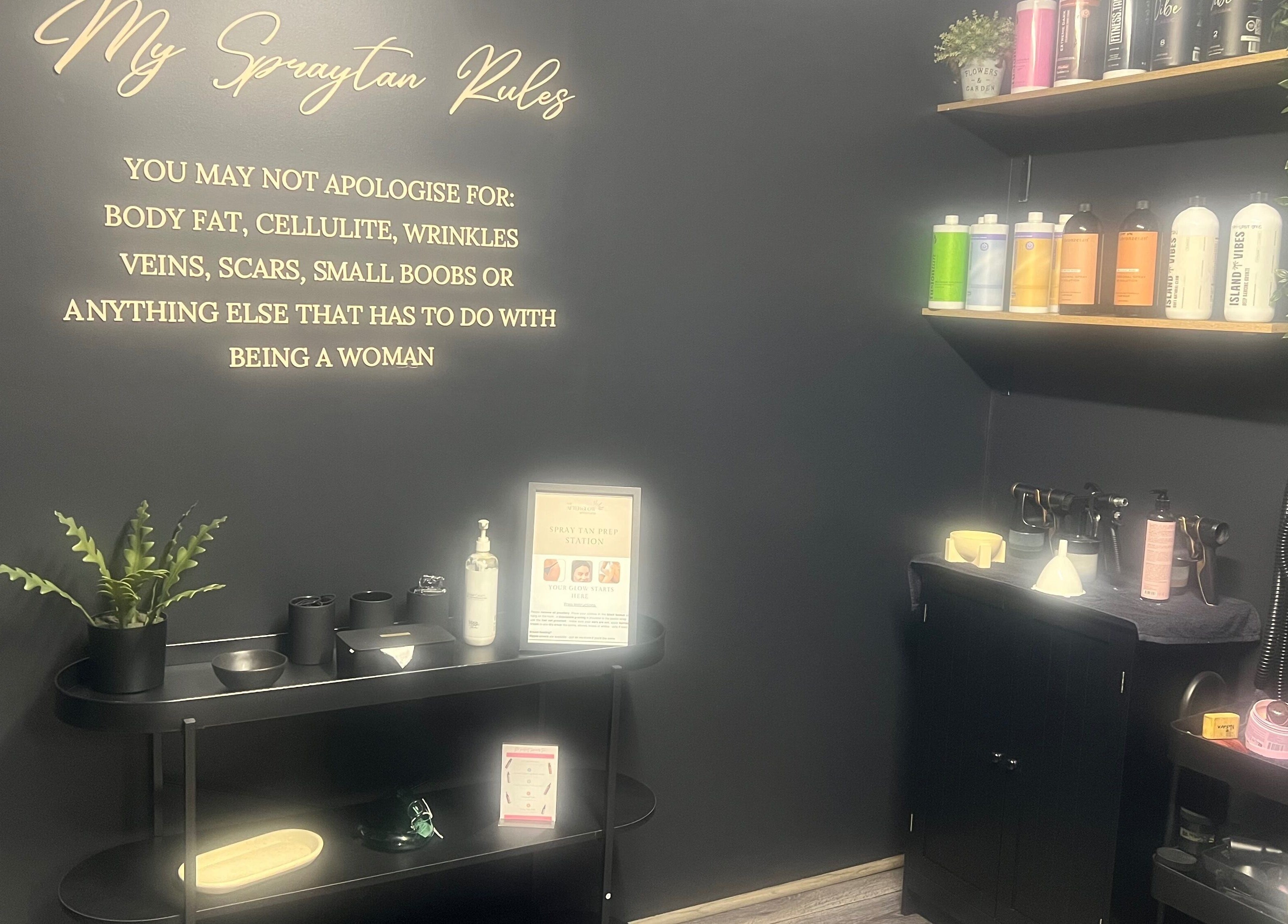 The Afterglow Spray Tans interior shows sleek products and motivational decor in Greenwith, South Australia, AU.
