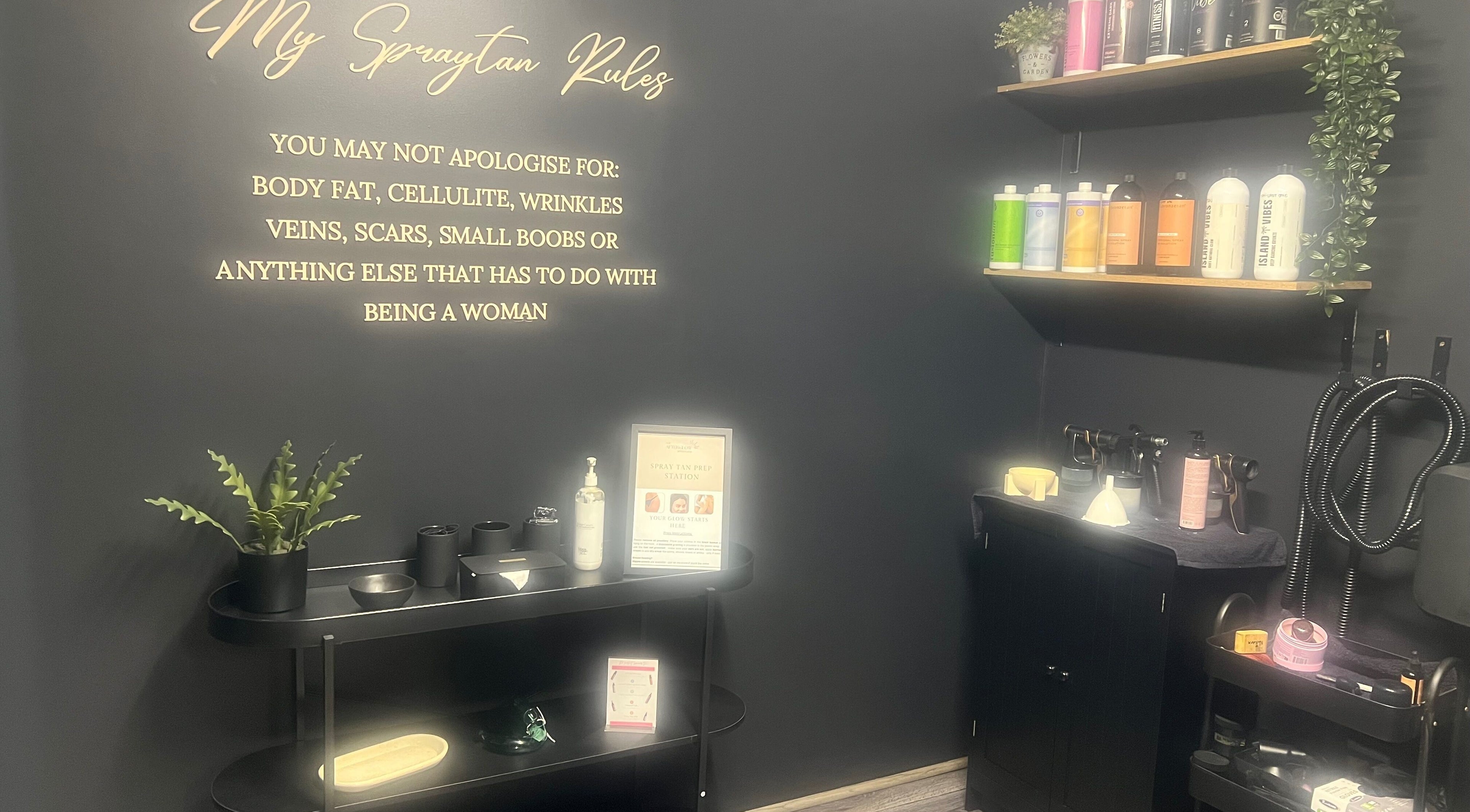 The Afterglow Spray Tans interior shows sleek products and motivational decor in Greenwith, South Australia, AU.