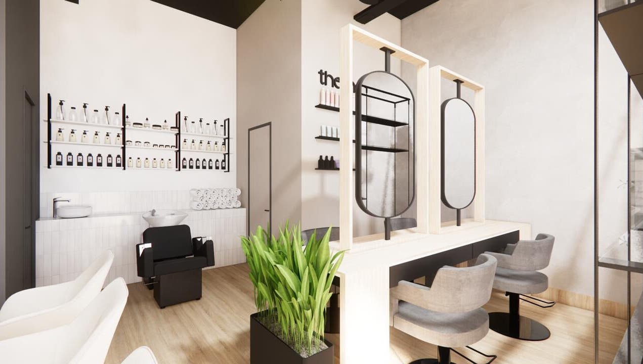 Interior moderno de The Nail Kitchen Villa Club en Daule, Guayas, EC con sillas elegantes y estanterías iluminadas.