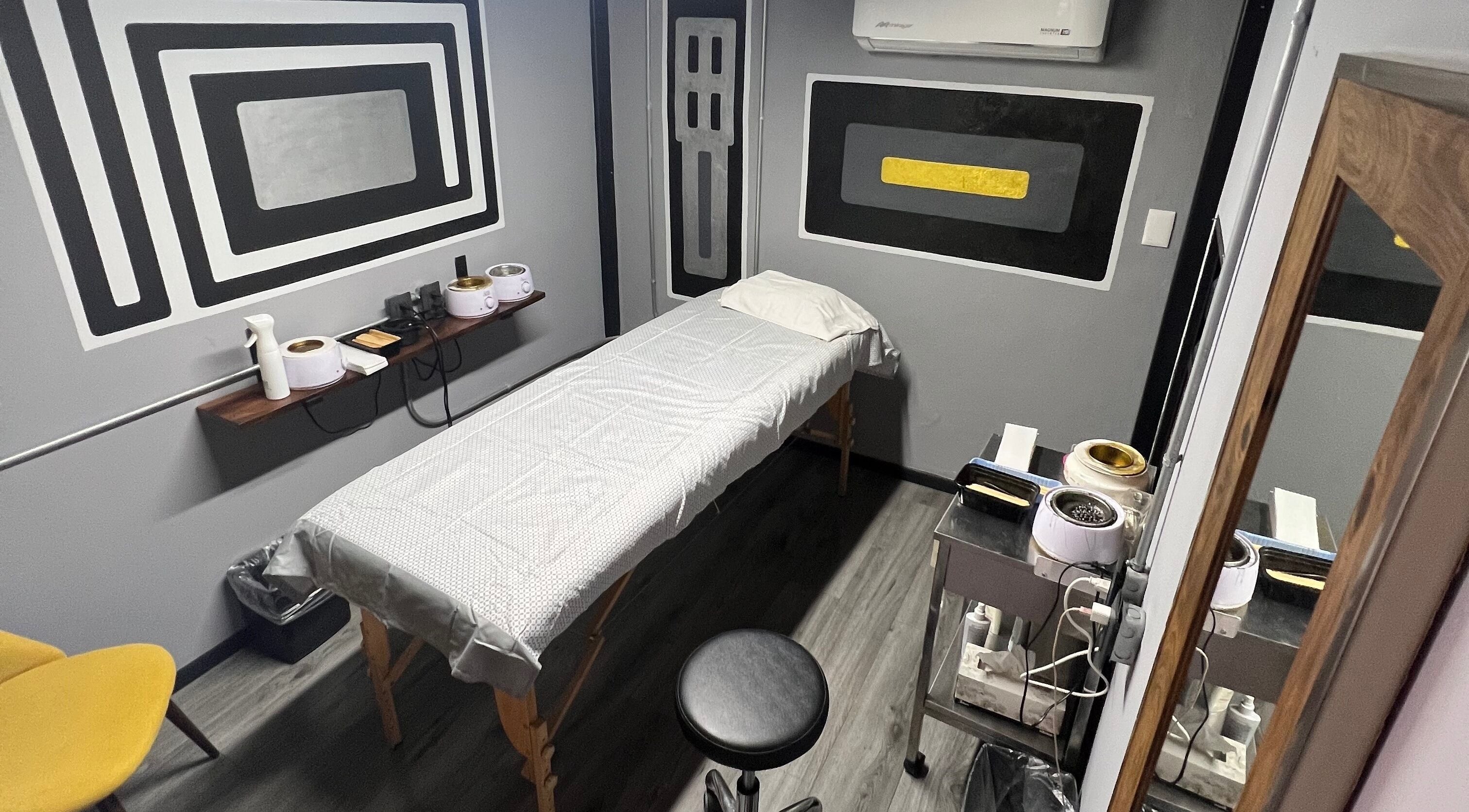 Modern waxing room at Waxing4Men in Puerto Vallarta, Jalisco, MX, featuring contemporary decor and equipment.