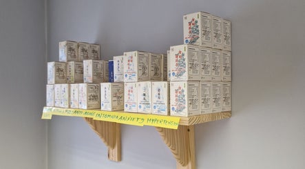 Herbal medicine boxes on a wooden shelf at AcuRodos - Acupuncture & Chinese Medicine Clinic, Clonee, Leinster, IE.