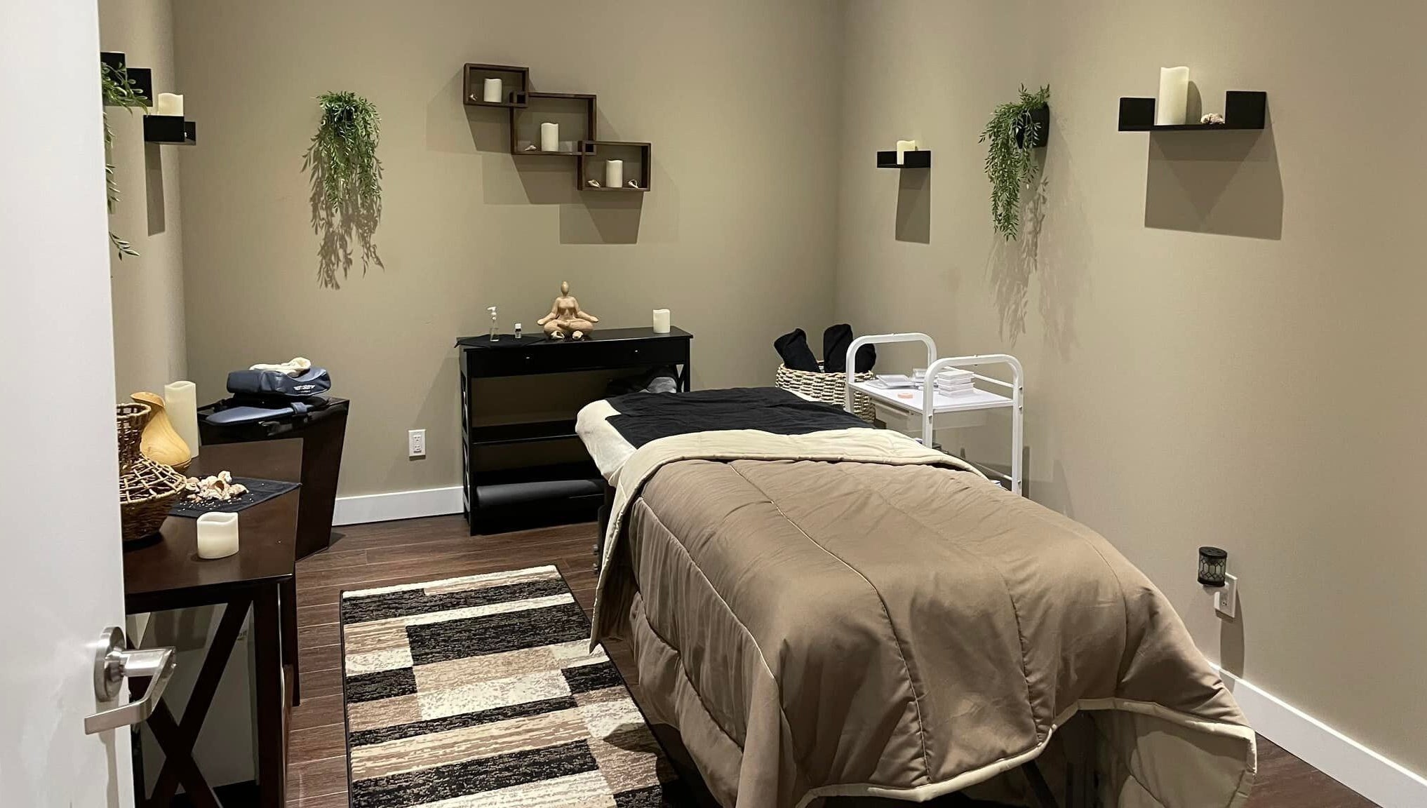 Serene treatment room at Nurse Cori Injectables & Aesthetics, Milton, Ontario, CA with cozy decor and massage bed.