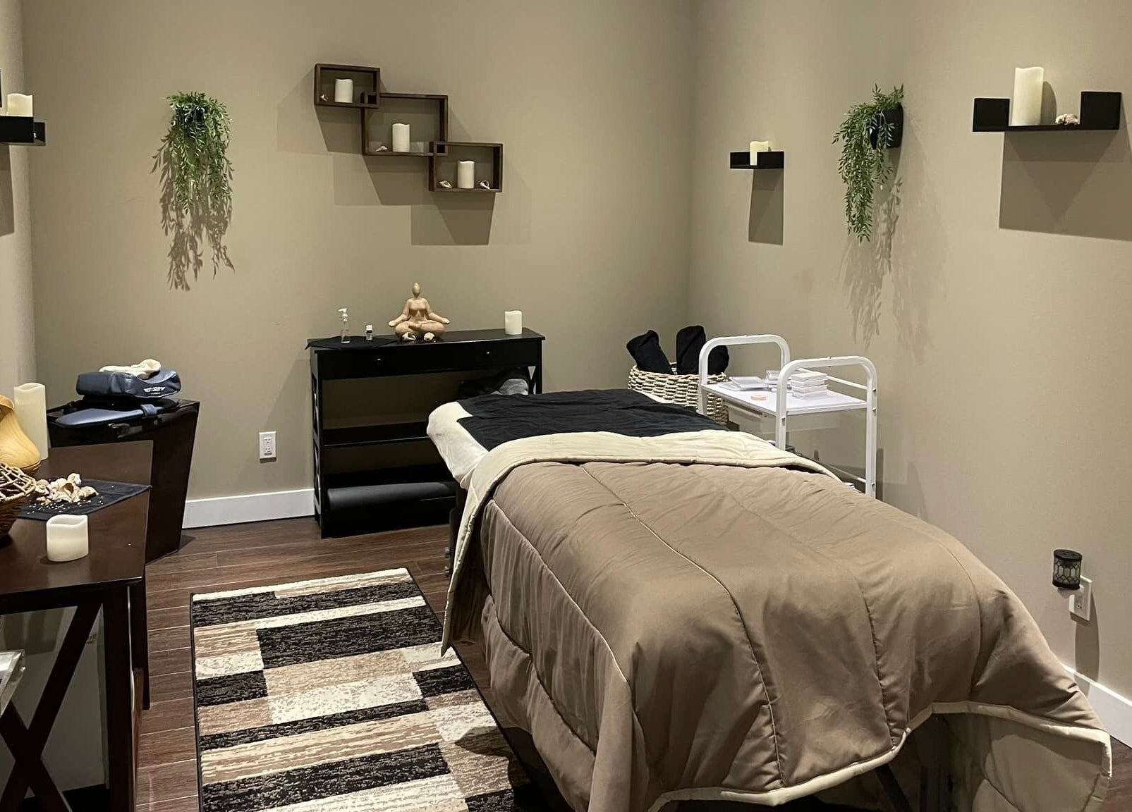 Serene treatment room at Nurse Cori Injectables & Aesthetics, Milton, Ontario, CA with cozy decor and massage bed.