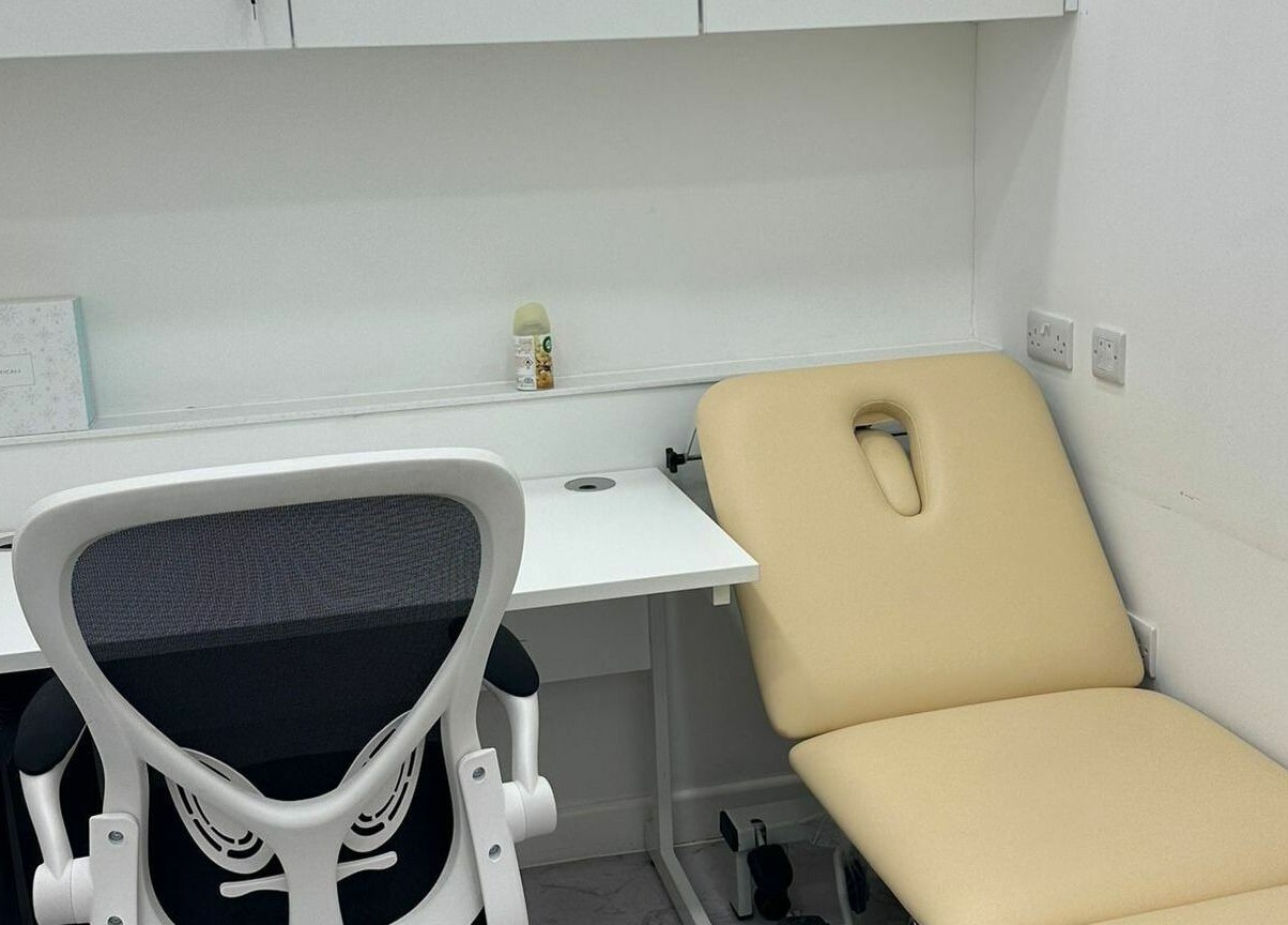 Modern treatment room setup at Z.Z SkinCare London, London, England, GB, featuring a sleek chair and treatment bed.