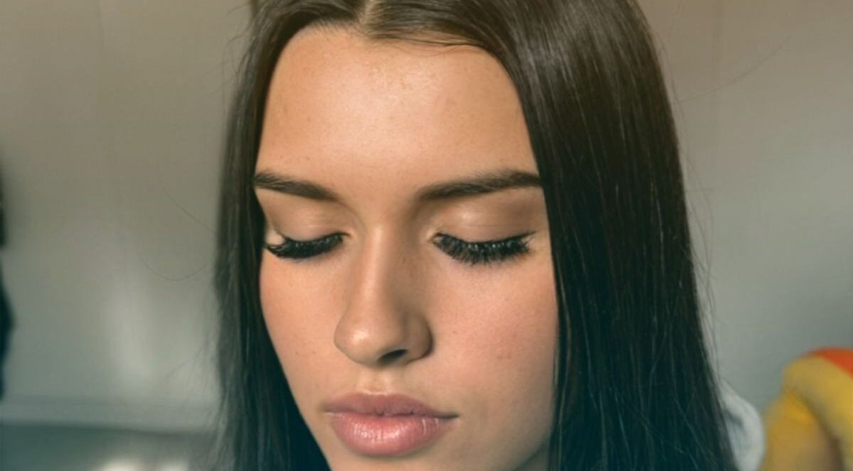 Close-up of a serene face with eyelash extensions at Tranquil Times Medi-Spa, Robertson, Western Cape, ZA.