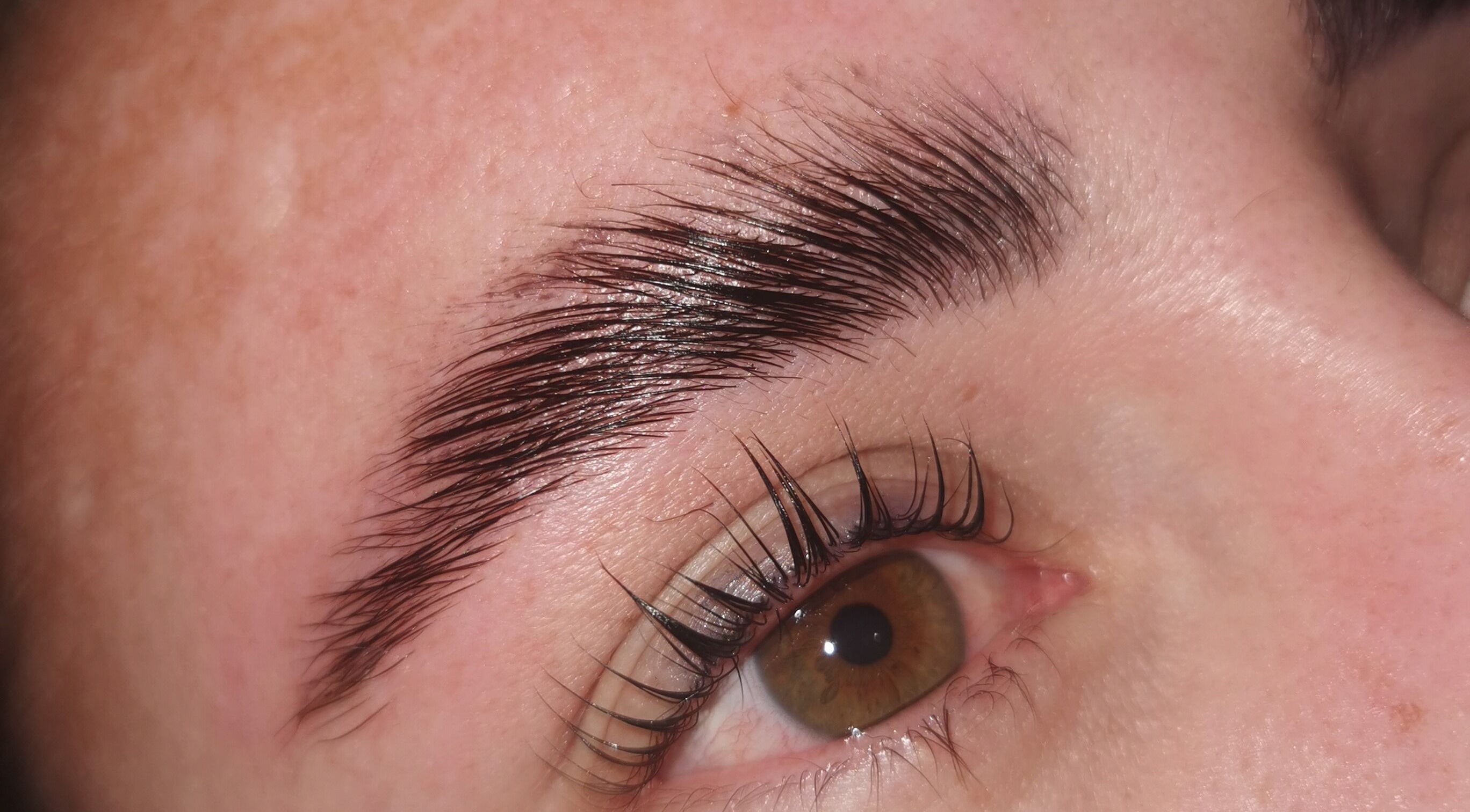 Close-up of expertly groomed eyebrow at Tranquil Times Medi-Spa, Robertson, Western Cape, ZA.