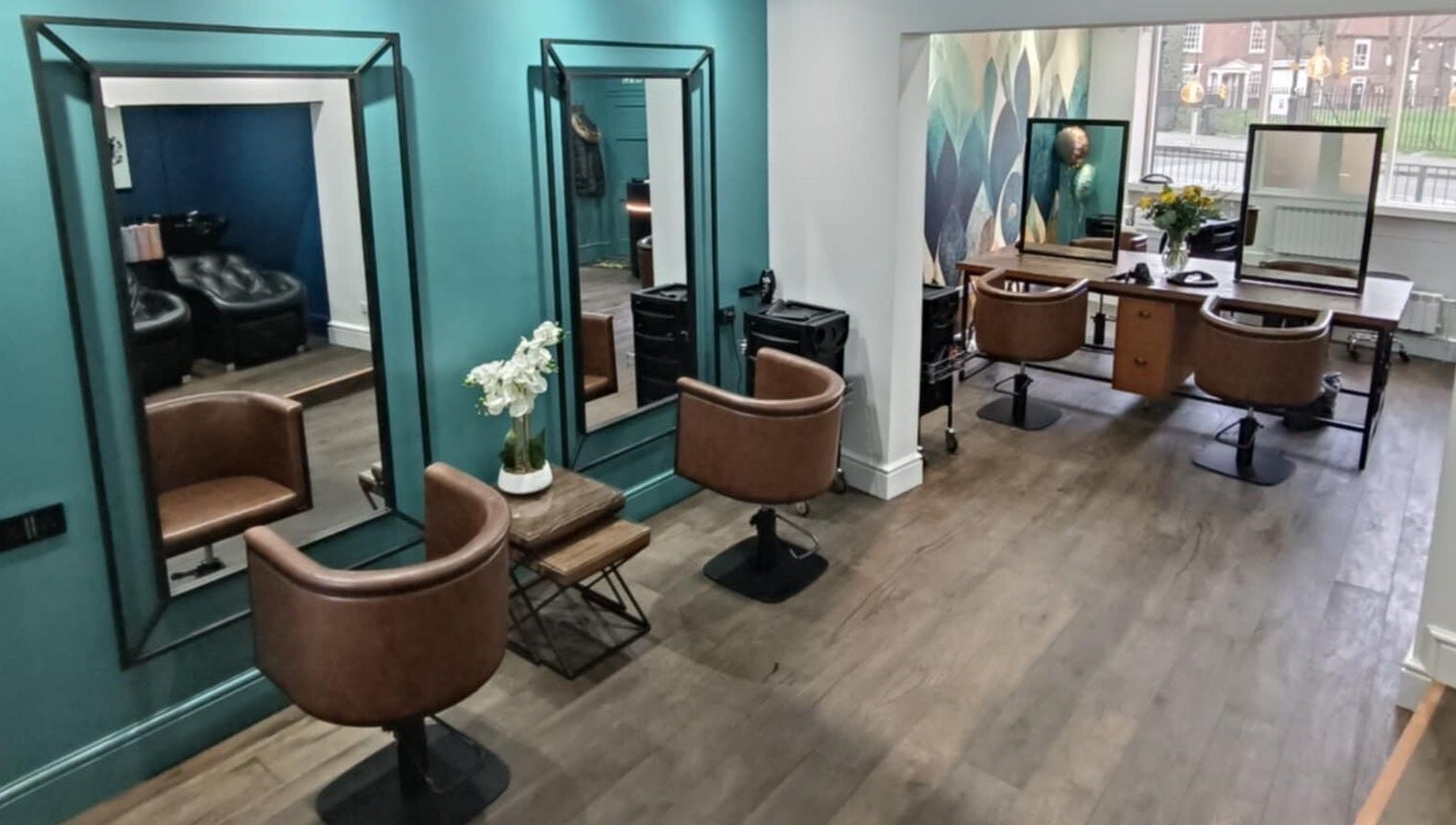 Modern styling chairs and mirrors at KaKoon in Selby, England, GB. Elegant and inviting salon space.