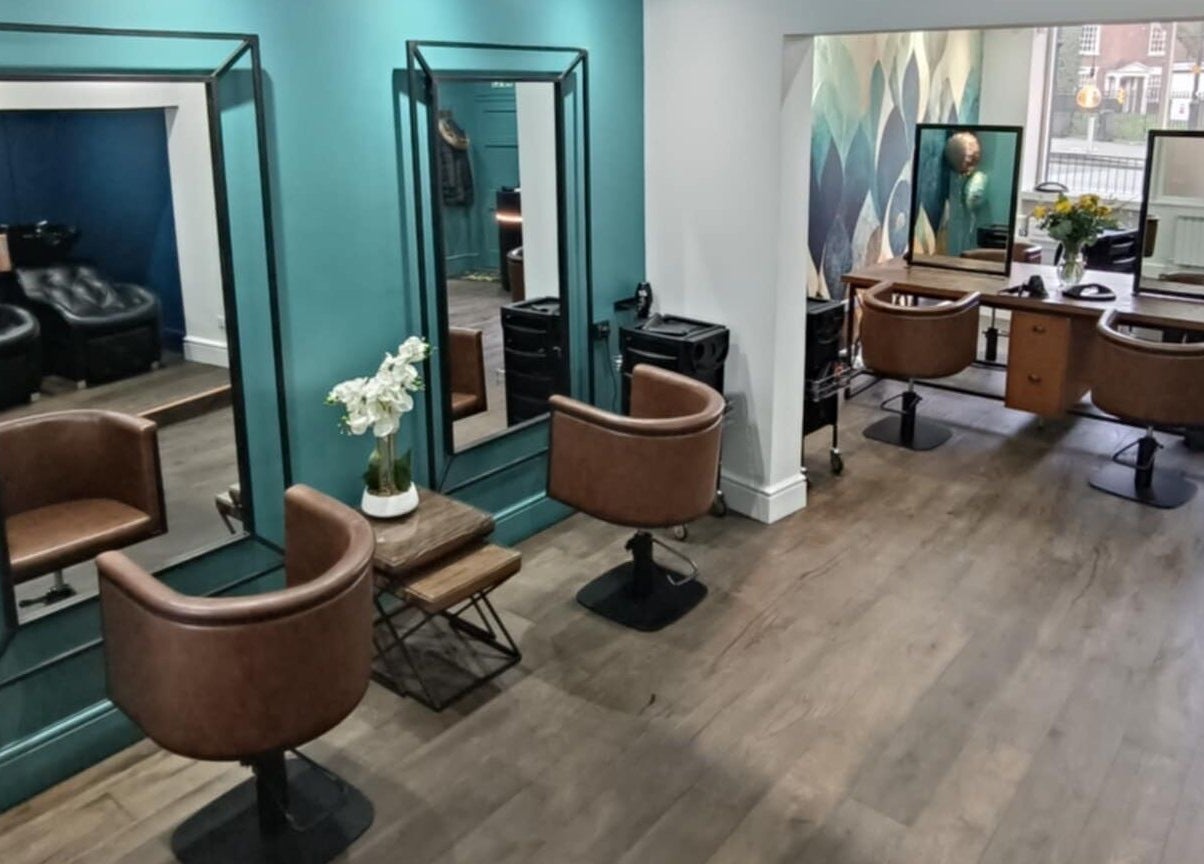 Modern styling chairs and mirrors at KaKoon in Selby, England, GB. Elegant and inviting salon space.