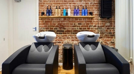Chic salon wash stations at The Ultimate Touch, Wymondham, England, GB, featuring sleek design and high-quality products.