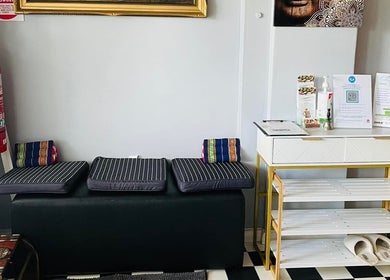 Reception at Narree Thai Massage & Spa in Wingham, New South Wales, AU with cozy seating and informational desk.