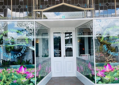 Entrance of Narree Thai Massage & Spa in Wingham, New South Wales, AU, featuring floral window graphics.