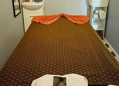 Comfortable massage room at Narree Thai Massage & Spa, Wingham, New South Wales, AU, with inviting bed and decor.
