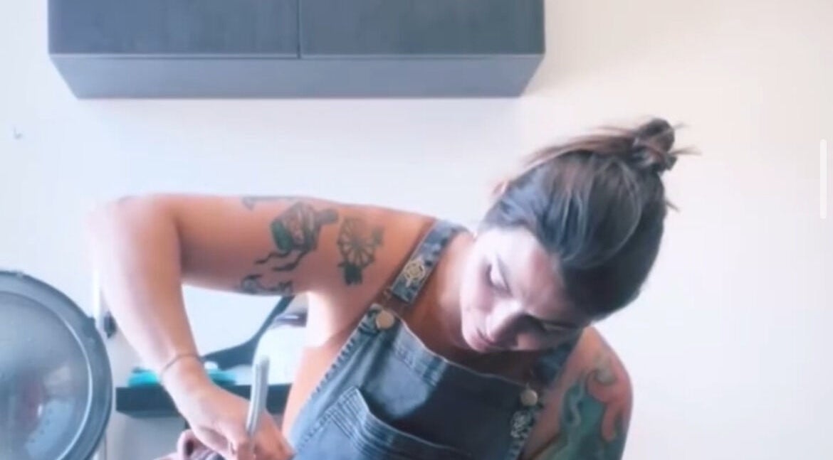 Tattooed stylist at work in LFG Styling by Lauren, Los Angeles, California, US.