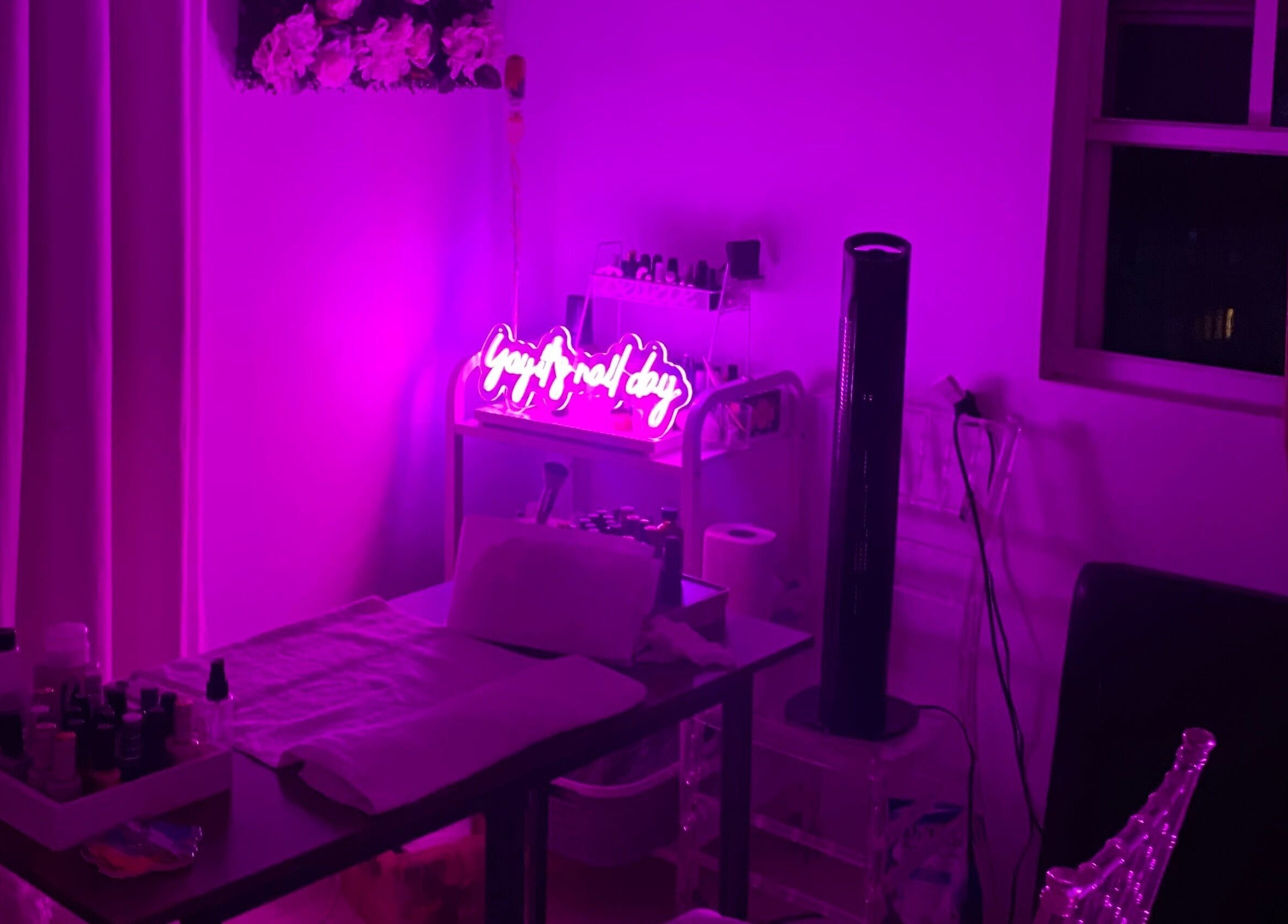 Chic spa room at Spa D’amour, Oistins, Christ Church, BB with vibrant neon purple lighting.