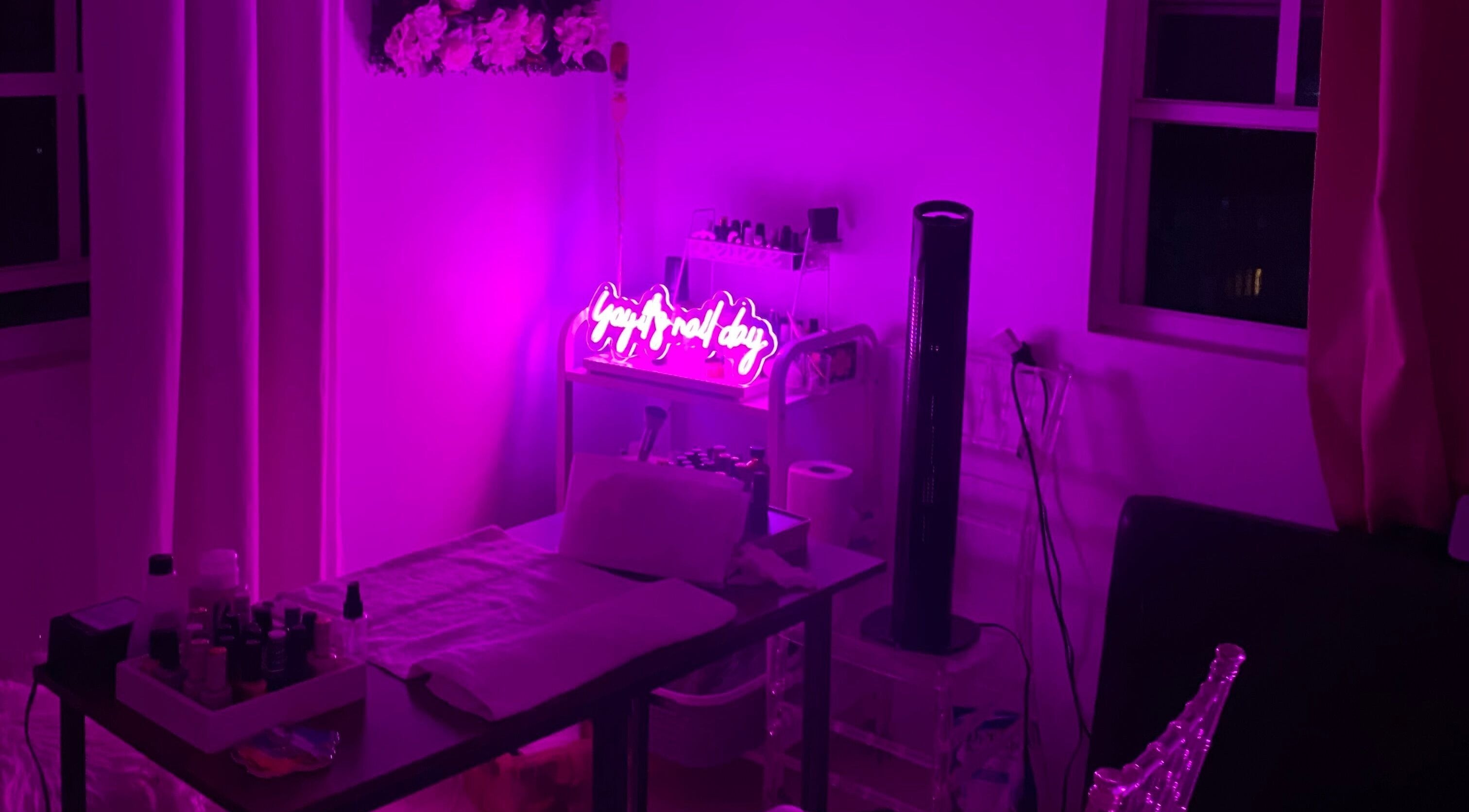 Chic spa room at Spa D’amour, Oistins, Christ Church, BB with vibrant neon purple lighting.