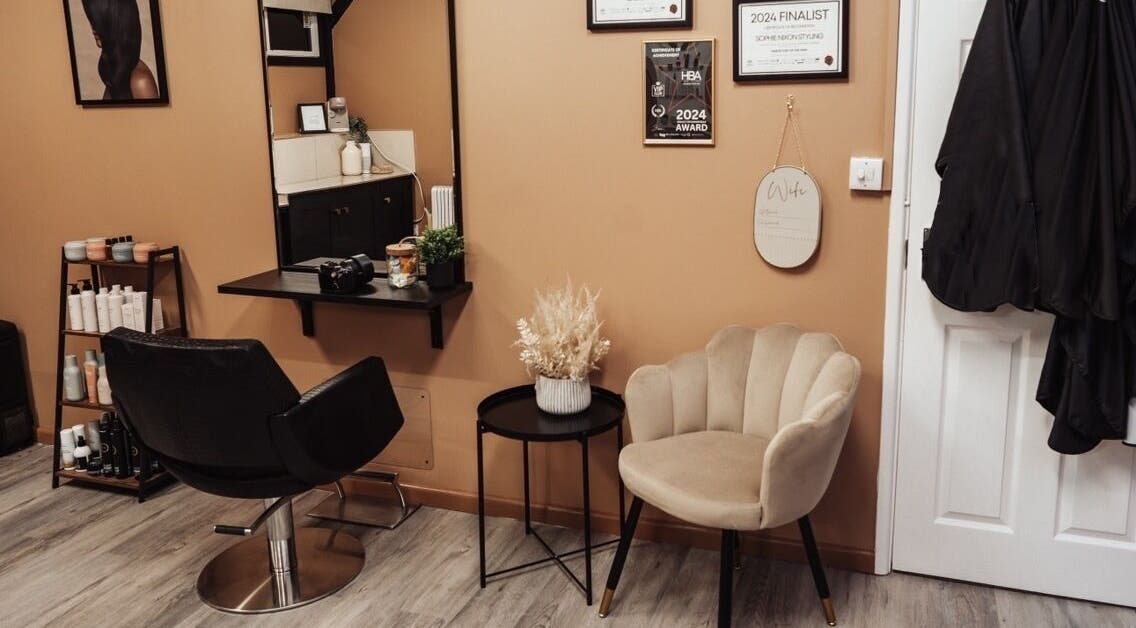 Elegant styling area at Sophie Nixon Styling, Midgham, England with modern decor and hair products.