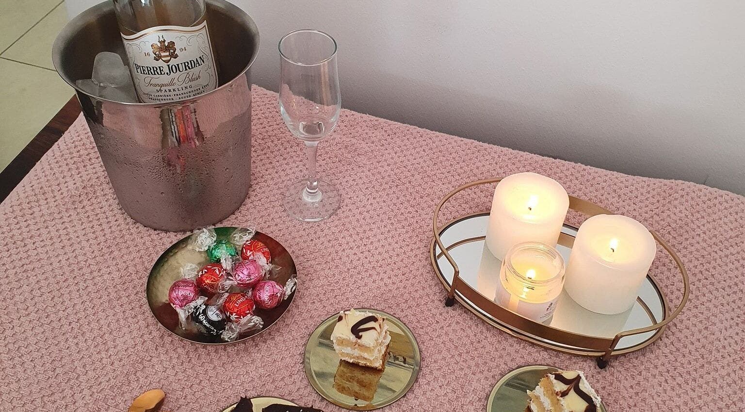 Luxury setup with champagne, candles, and sweets at Beauty Rejuvenation, Gqeberha, Eastern Cape, ZA.