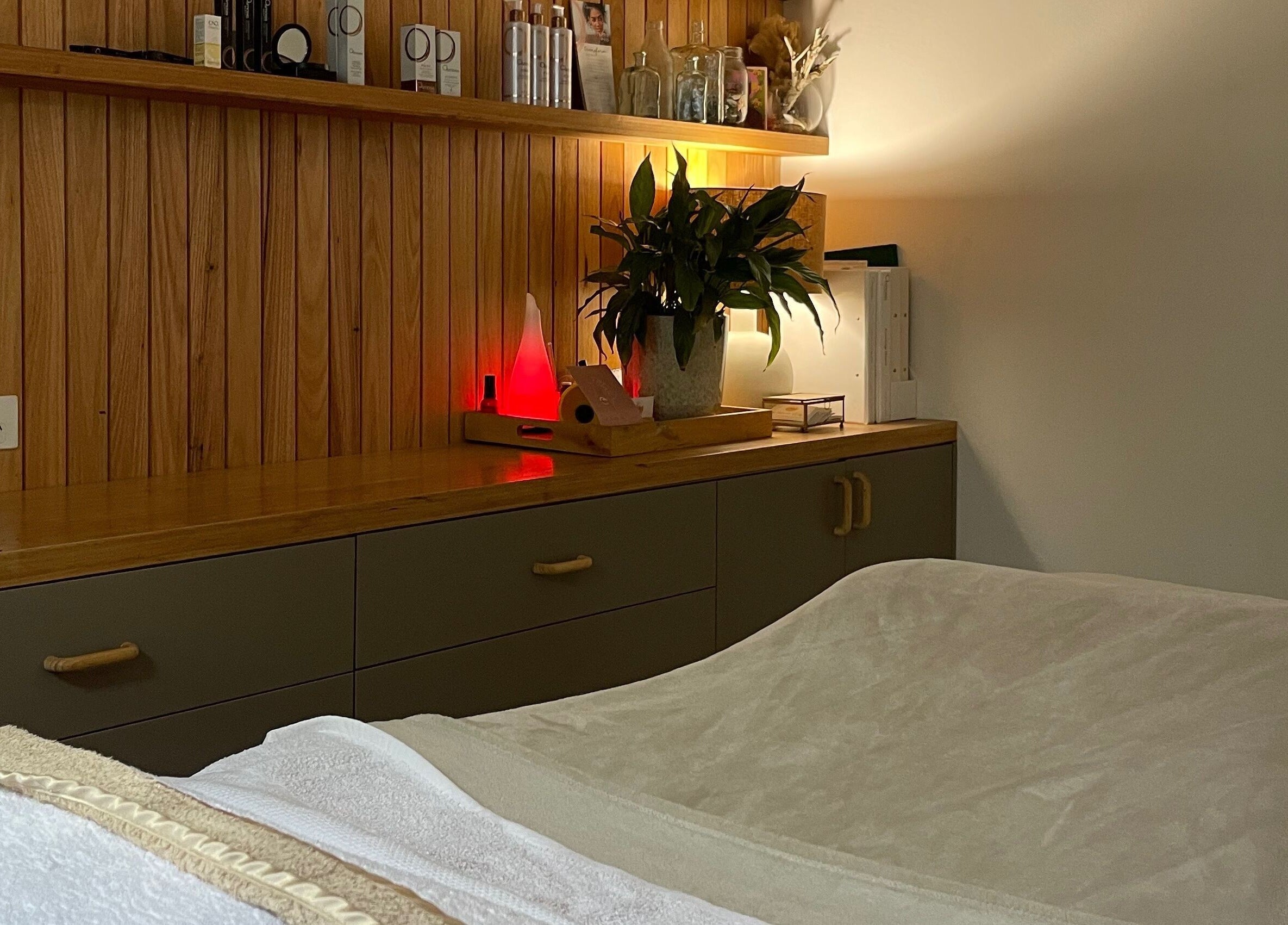 Cozy treatment room at The Moonah Studio, Blairgowrie, Victoria, AU with wooden decor and soft lighting.