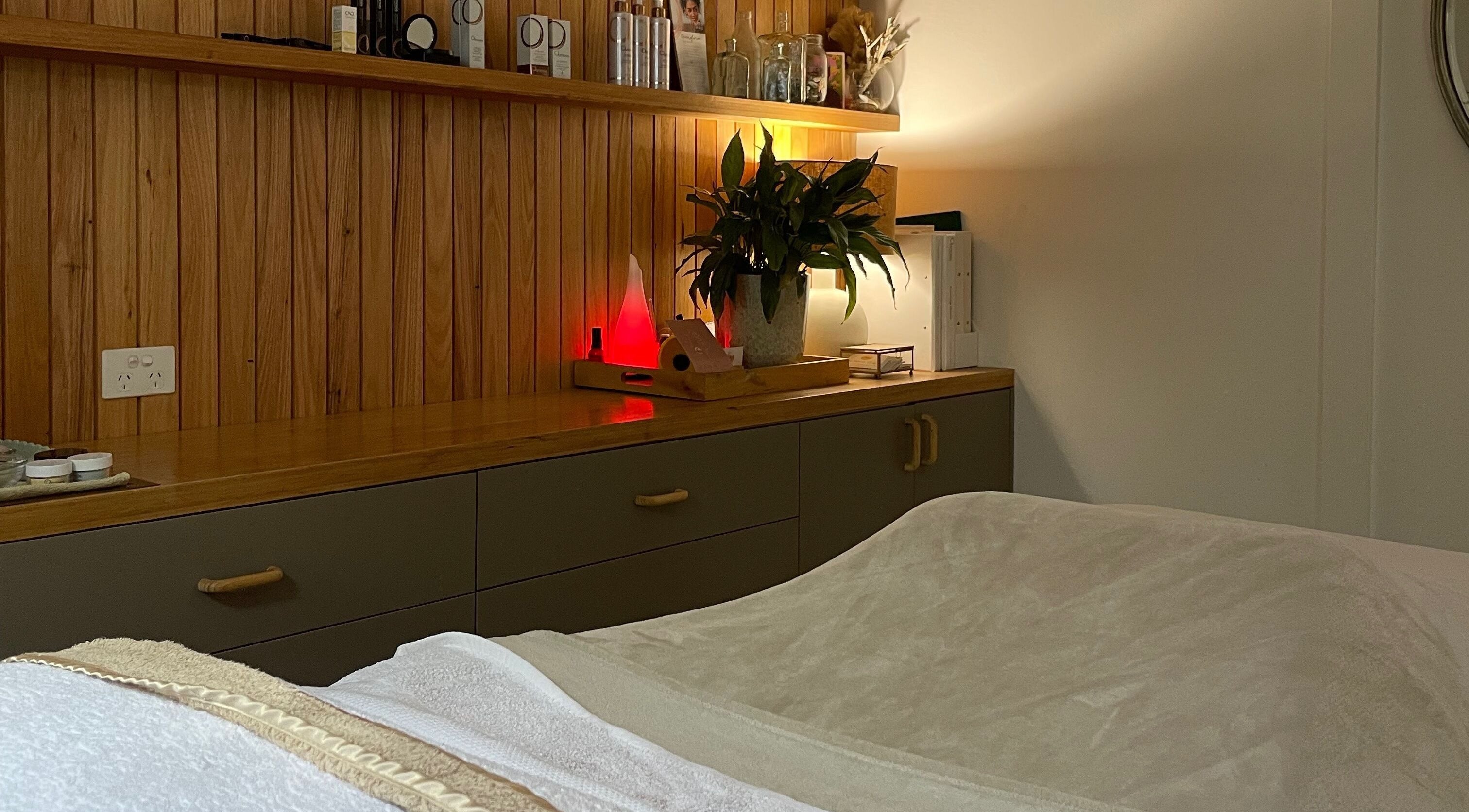 Cozy treatment room at The Moonah Studio, Blairgowrie, Victoria, AU with wooden decor and soft lighting.