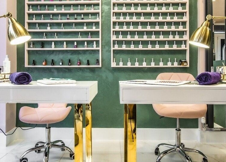 Luxury nail station at Beautie.Lab Aesthetics, London, England, GB, featuring elegant gold and pink decor.