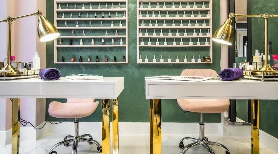 Luxury nail station at Beautie.Lab Aesthetics, London, England, GB, featuring elegant gold and pink decor.