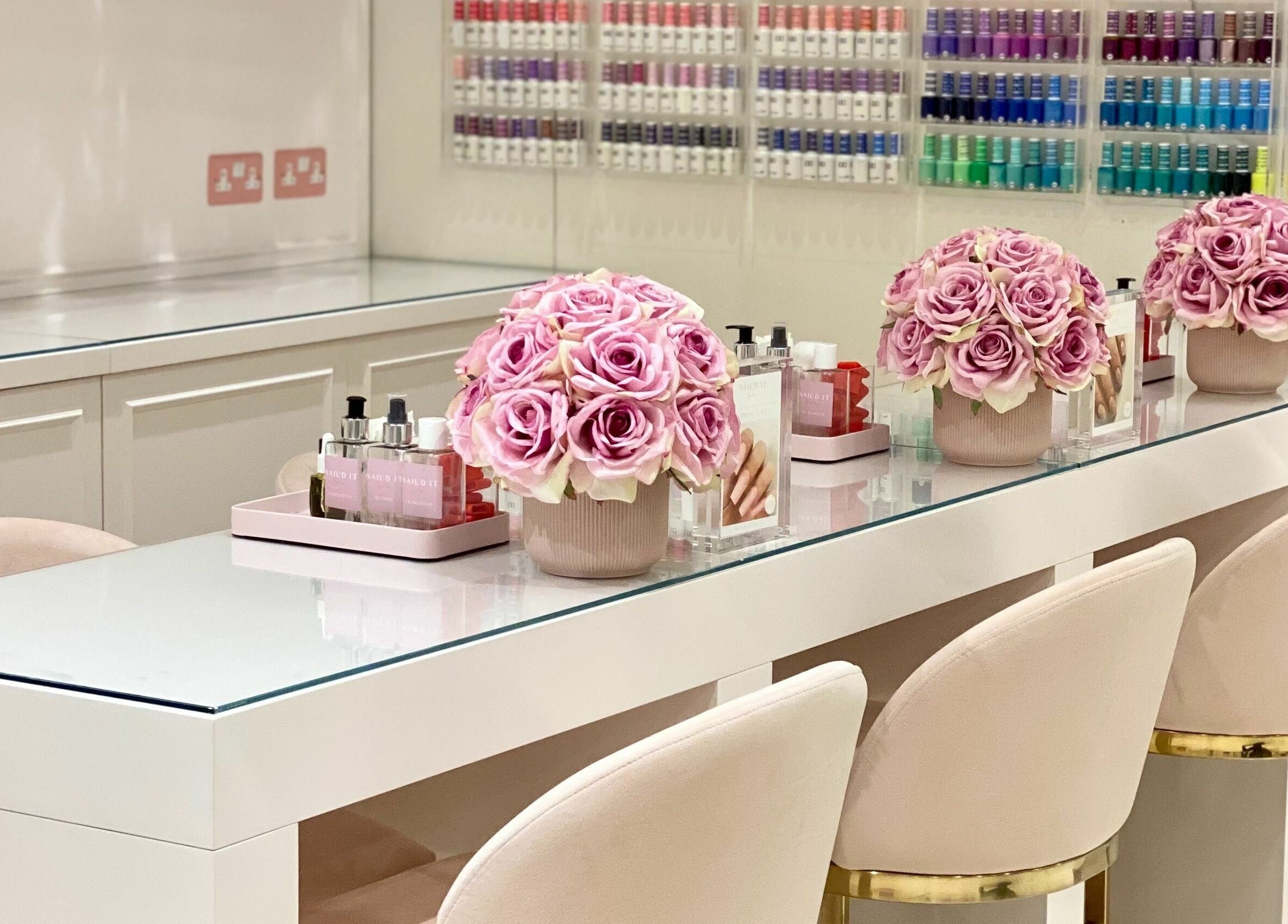 Chic manicure station at Nail’d It x Harvey Nichols Edinburgh with pink roses, Edinburgh, Scotland, GB.