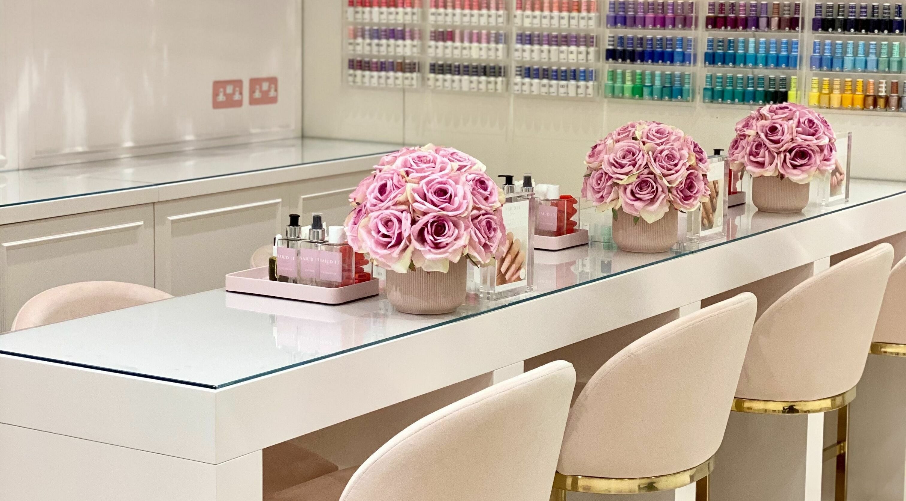 Chic manicure station at Nail’d It x Harvey Nichols Edinburgh with pink roses, Edinburgh, Scotland, GB.