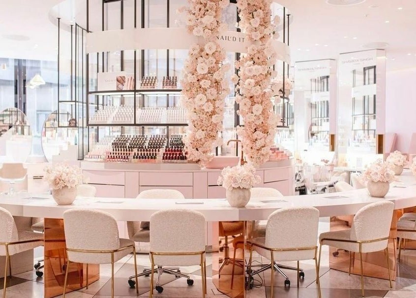 Chic interior of Nail’d It x Harvey Nichols Edinburgh in Edinburgh, Scotland, GB featuring plush seating and floral decor.