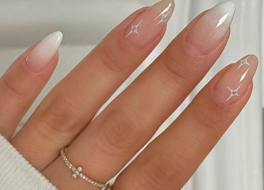 Elegant ombre nails with sparkles at Nail’d It x Harvey Nichols Edinburgh in Edinburgh, Scotland, GB.