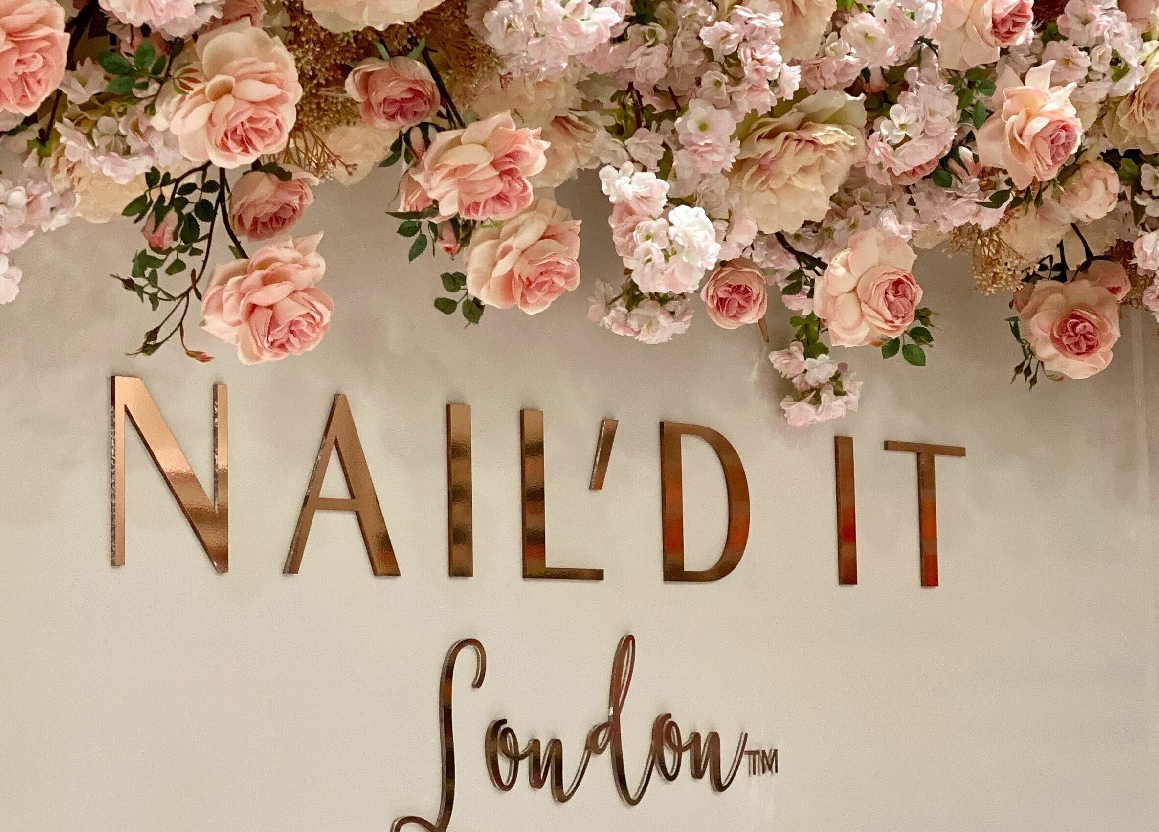 Elegant floral display at Nail’d It x Harvey Nichols Edinburgh, Edinburgh, Scotland, GB, highlighting luxury beauty.