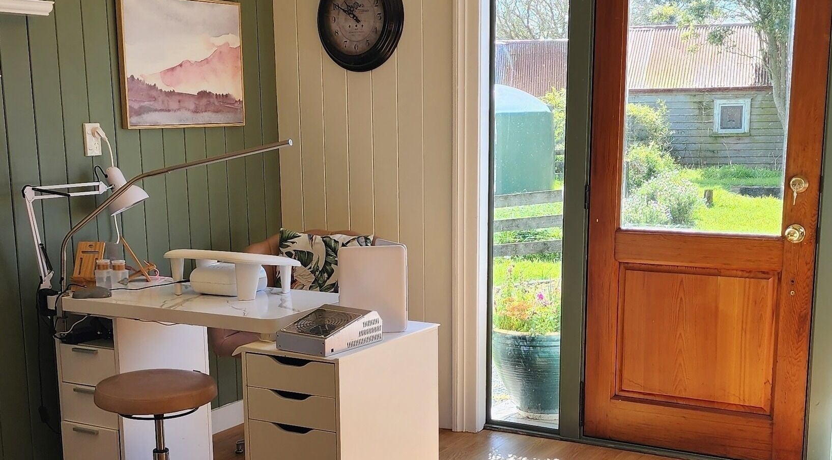 Cozy nail workspace at Nails by Becca - Woodbine Studios, Rotoorangi, Waikato, NZ, with garden view.