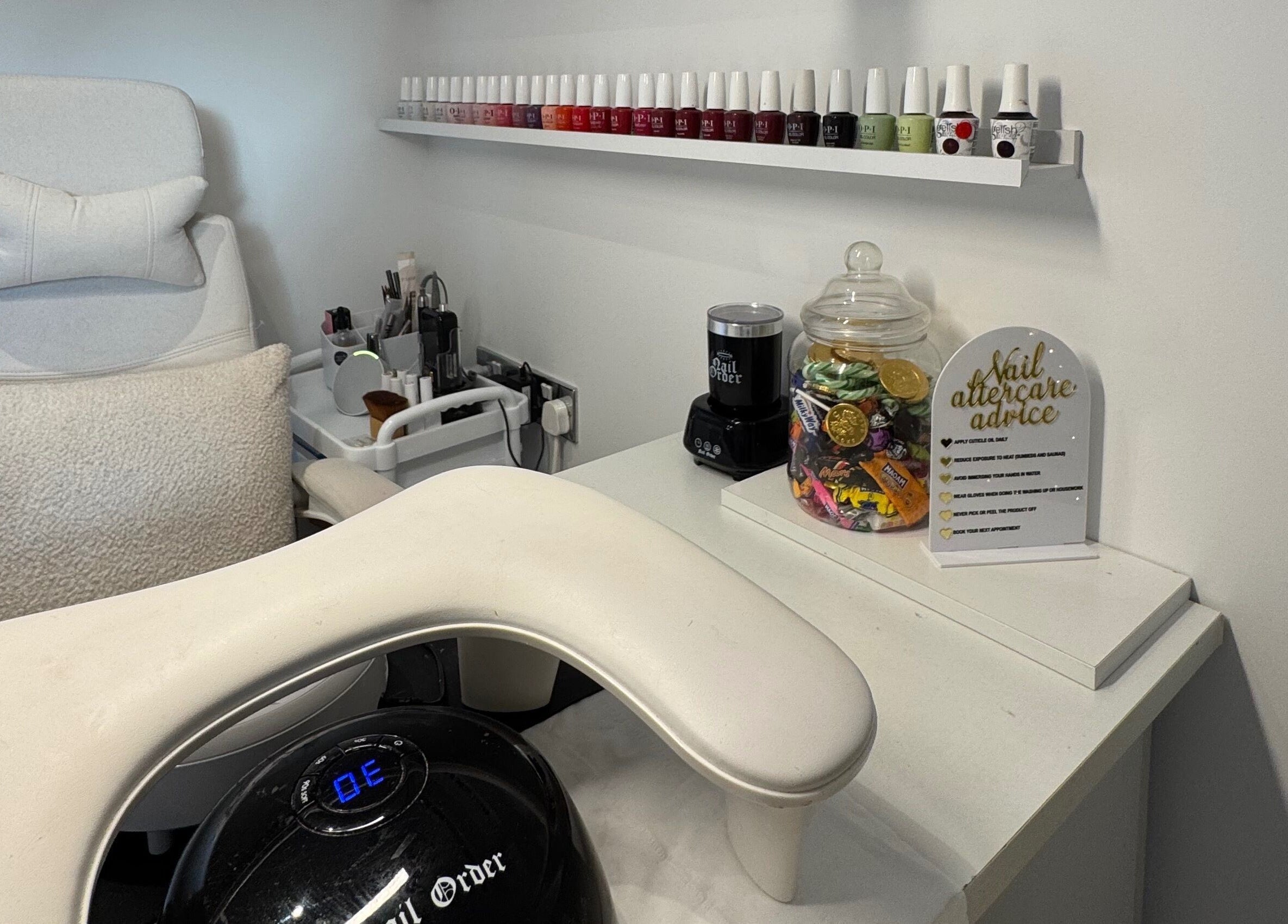 Manicure station at Woolton Beauty Lounge, Liverpool, England, GB featuring nail polish and care advice.