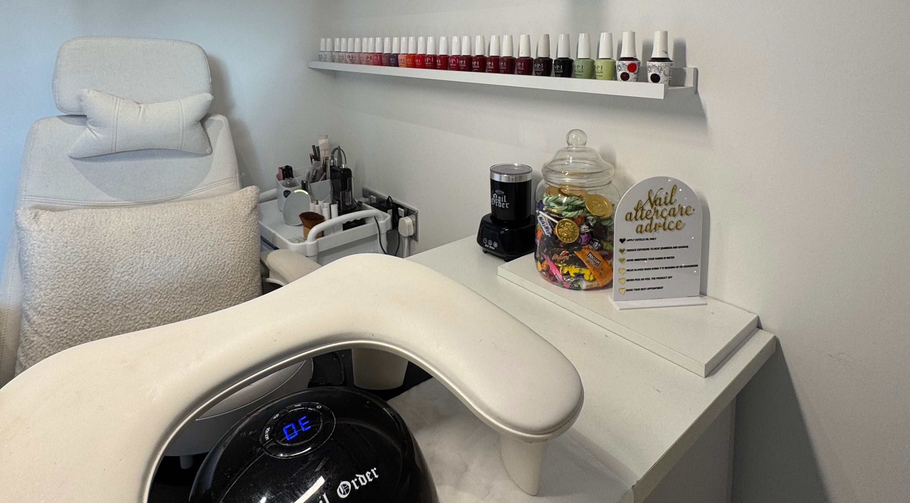 Manicure station at Woolton Beauty Lounge, Liverpool, England, GB featuring nail polish and care advice.