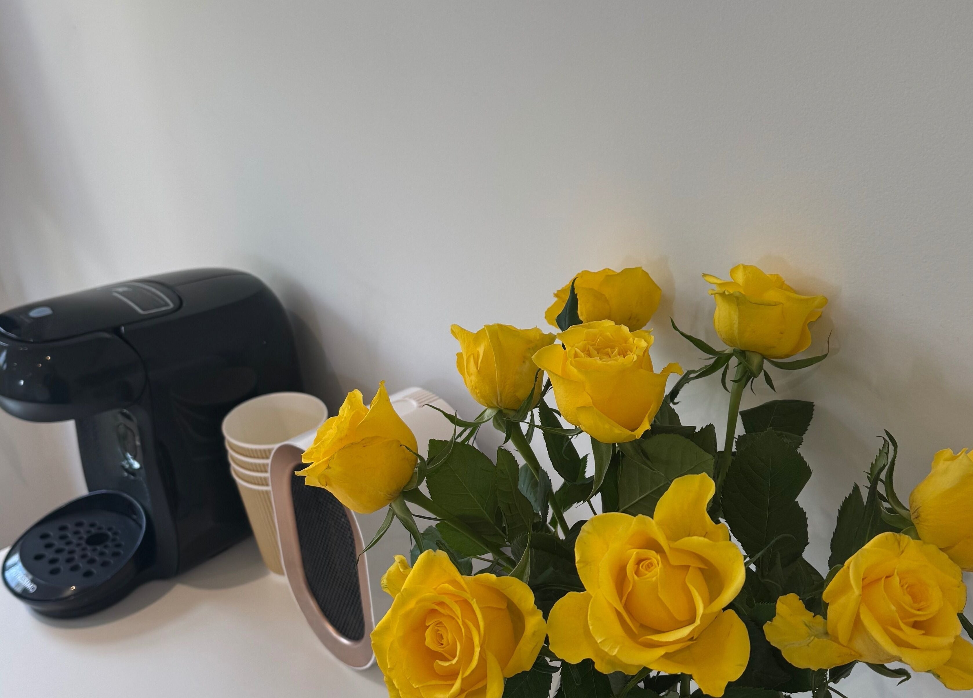 Yellow roses and coffee maker at Woolton Beauty Lounge, Liverpool, England, GB.