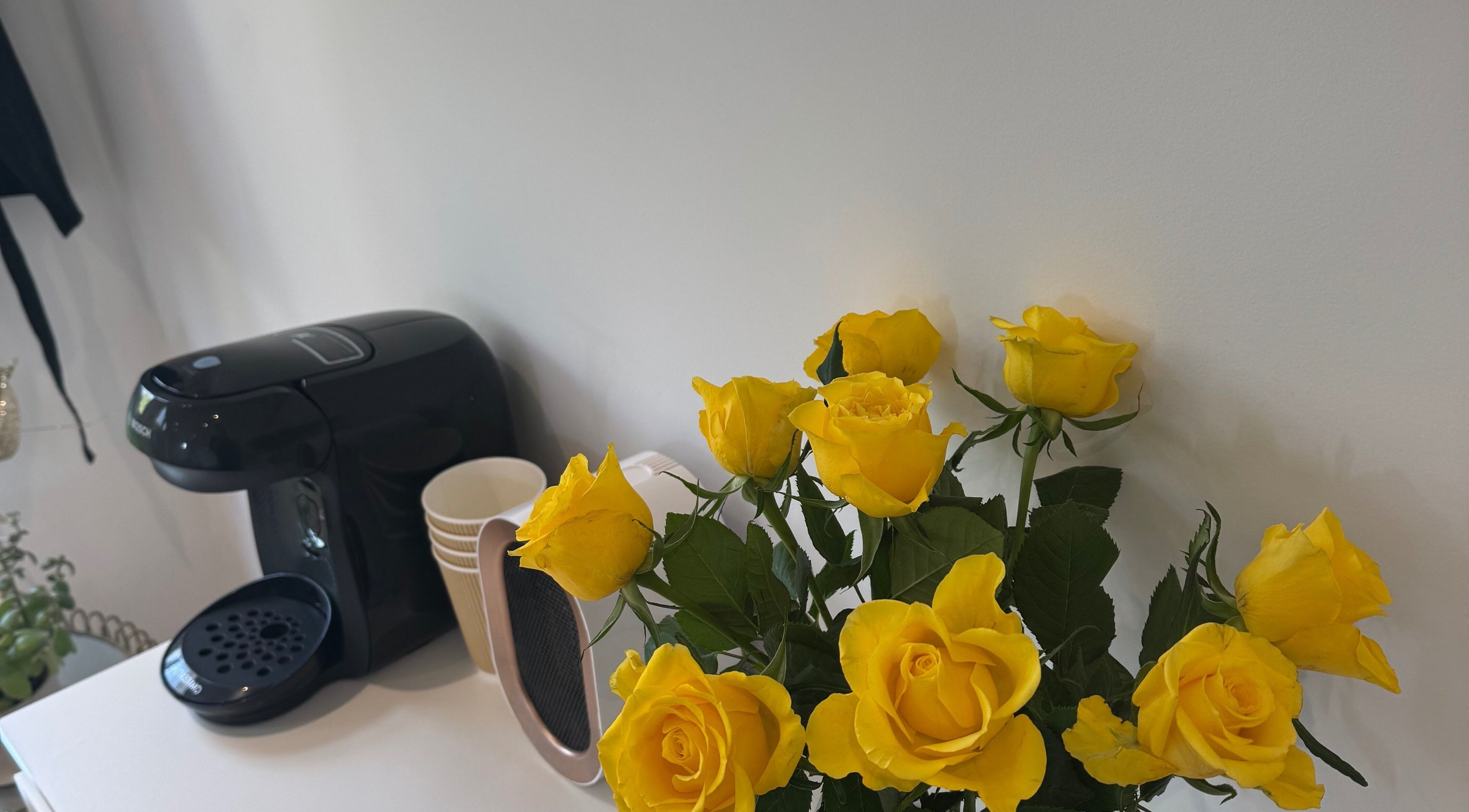 Yellow roses and coffee maker at Woolton Beauty Lounge, Liverpool, England, GB.