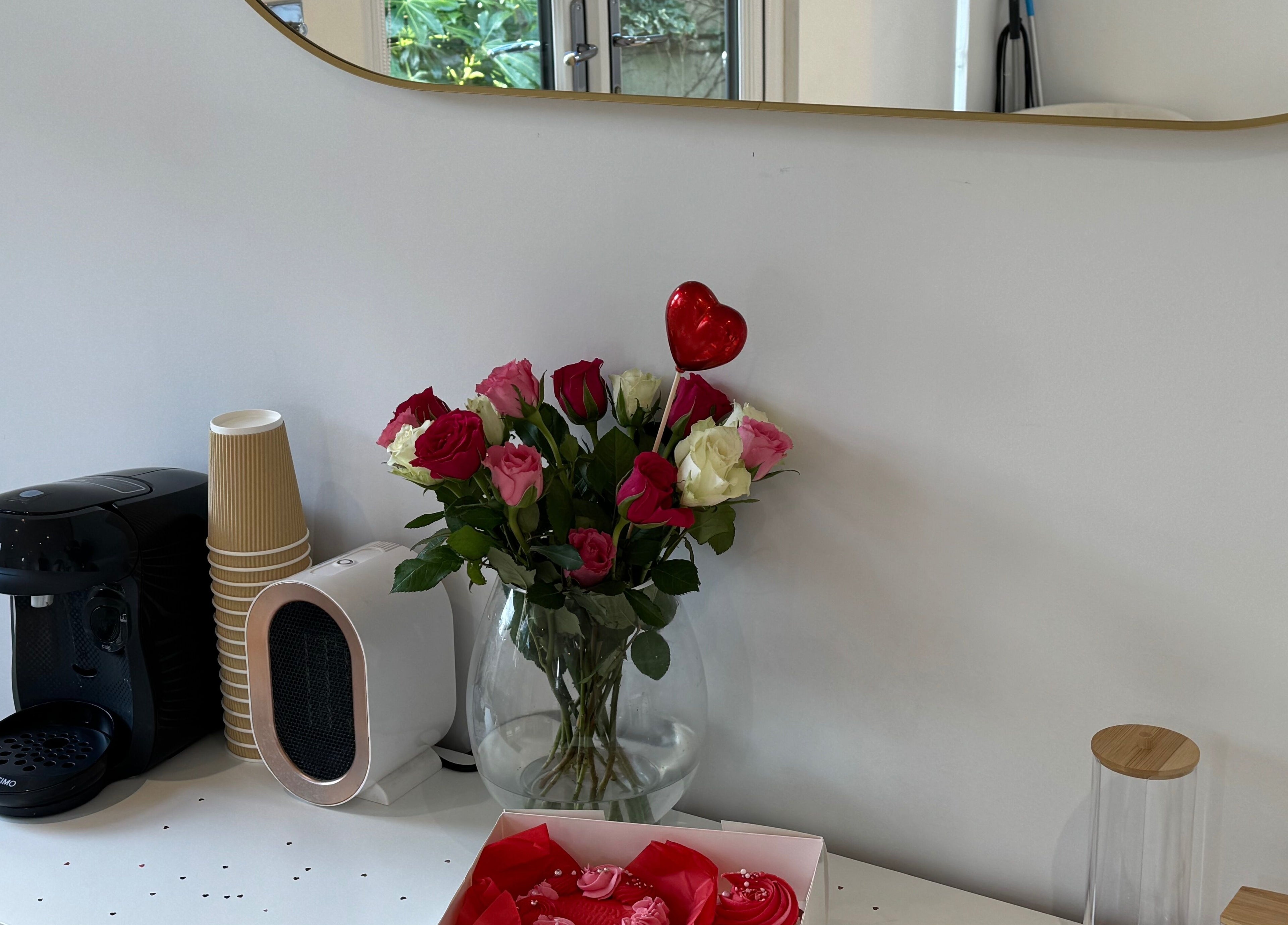Floral arrangement and coffee setup at Woolton Beauty Lounge, Liverpool, England, GB adding a touch of elegance.