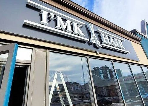 Exterior of I'mk Hair Salon in Calgary, Alberta, CA, showcasing modern design and welcoming entrance.
