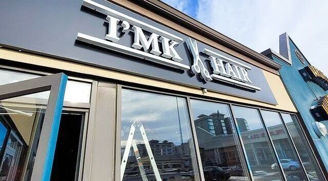 Exterior of I'mk Hair Salon in Calgary, Alberta, CA, showcasing modern design and welcoming entrance.