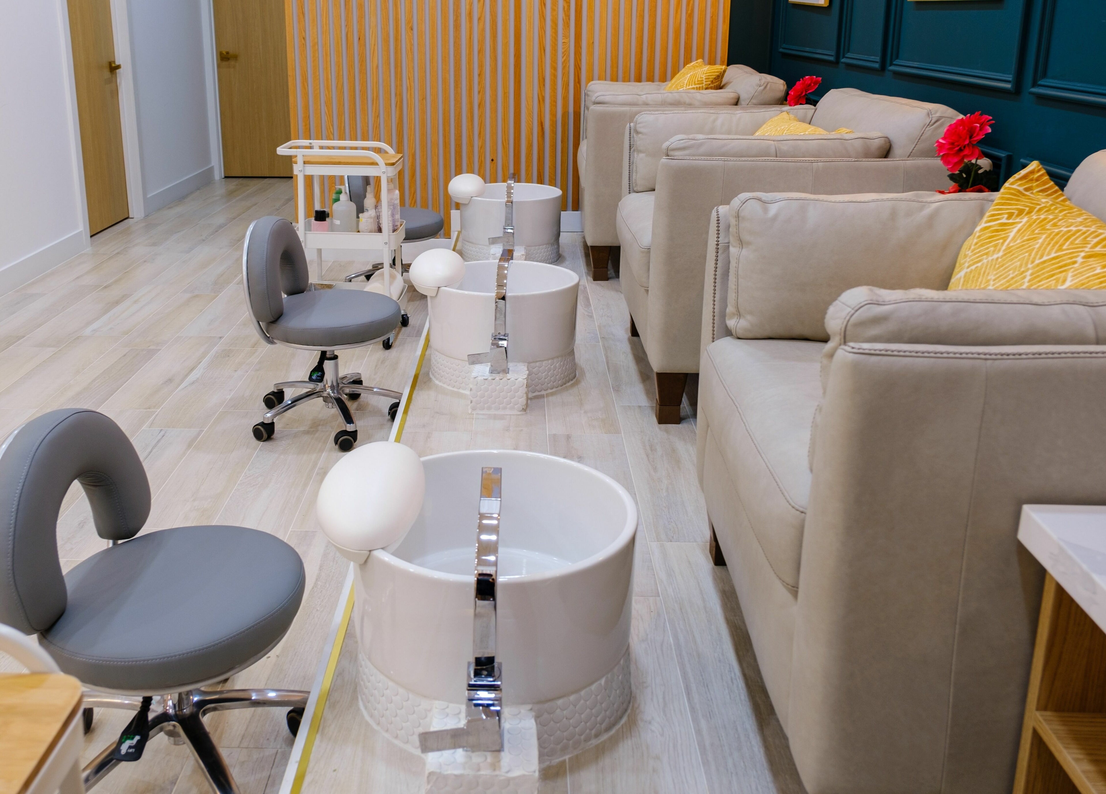 Elegant pedicure lounge at One23 Beauty Bar, Vaughan, Ontario, CA, with plush seating and modern foot spas.