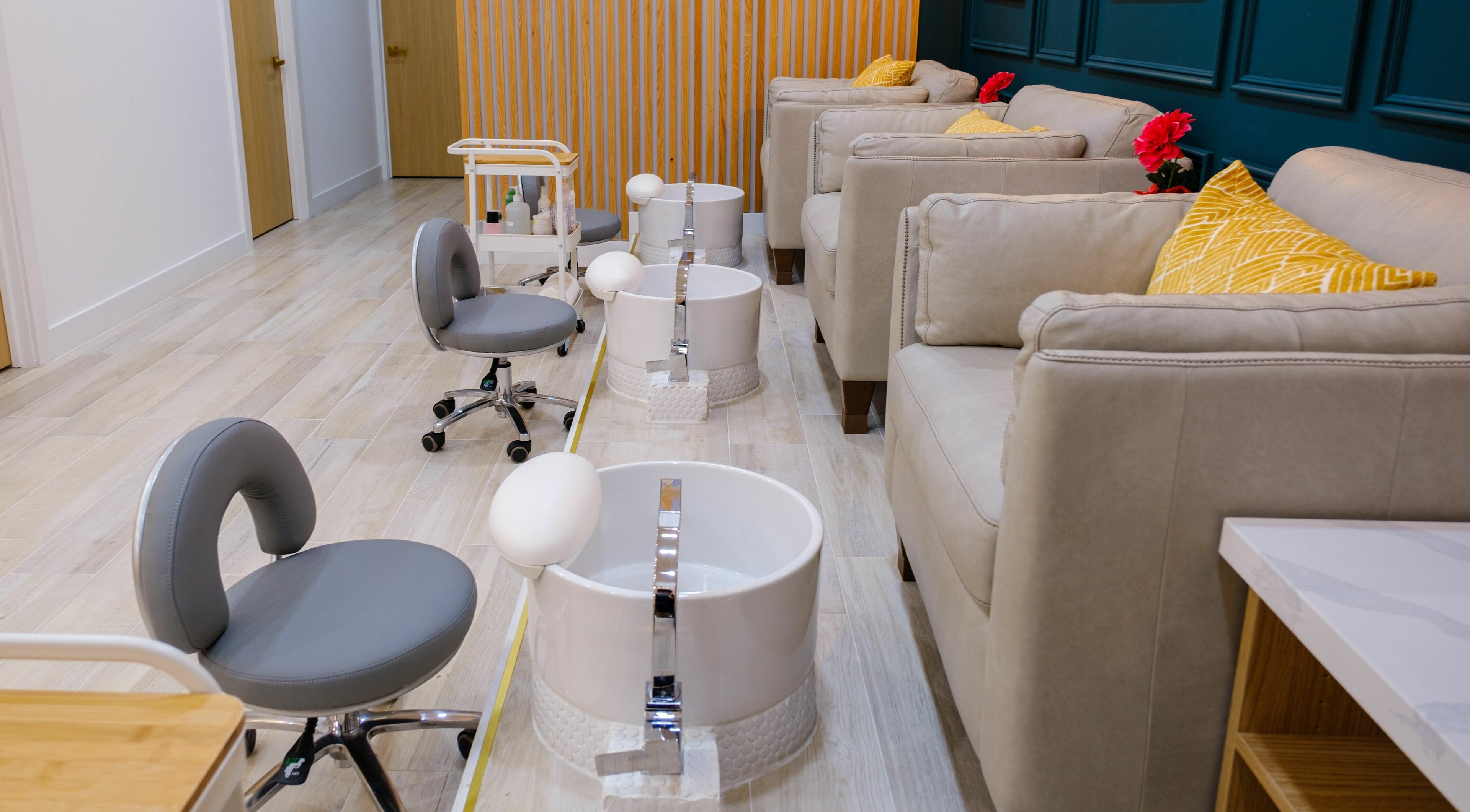 Elegant pedicure lounge at One23 Beauty Bar, Vaughan, Ontario, CA, with plush seating and modern foot spas.